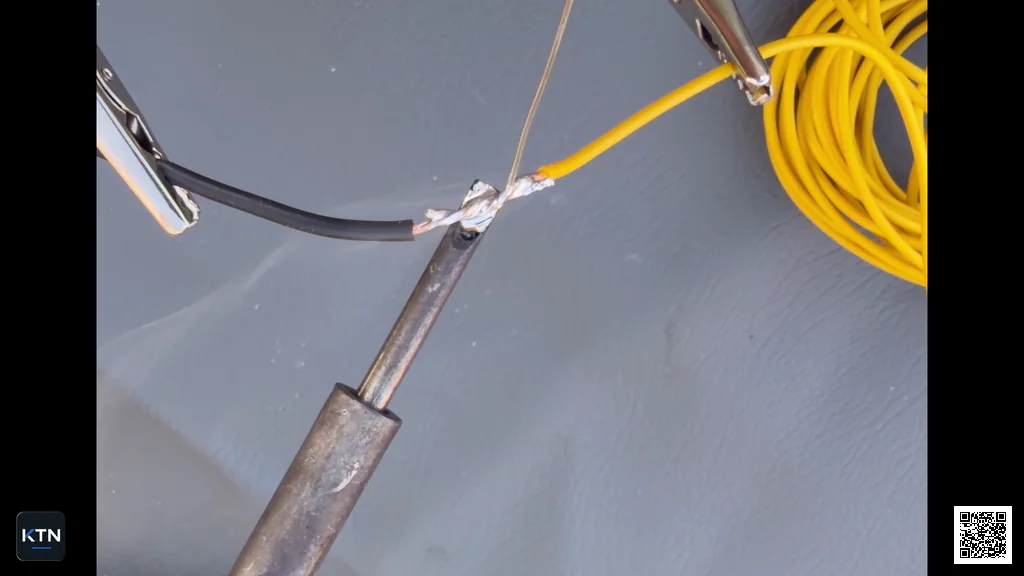 Molten solder flowing in between the copper strands in the wire splice